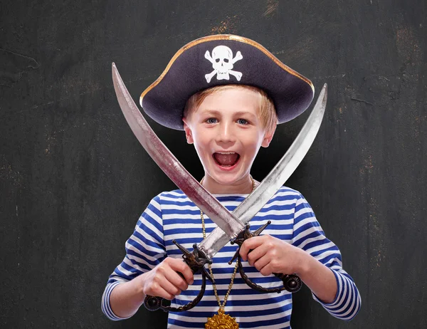 Little boy dressed as pirate