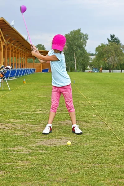 Golf, golfer, a little girl learning to play golf