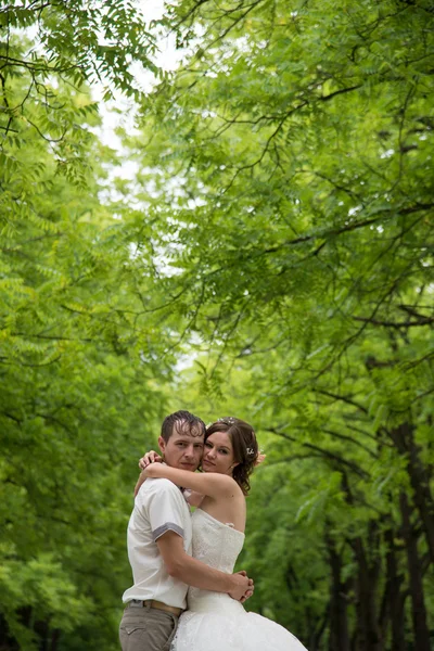 Young family on the wedding day for a walk