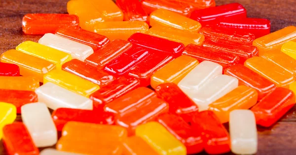 Closeup rectangular colorful shiny hard candy lined up