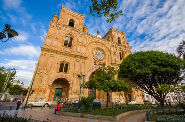 Cuenca, Ecuador - April 22, 2015: Spectacular main cathedral located in the heart of city, beautiful brick architecture and facade as seen from street level