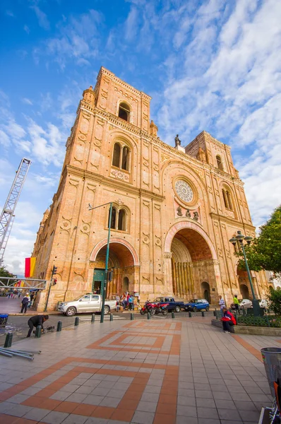 Cuenca, Ecuador - April 22, 2015: Spectacular main cathedral located in the heart of city, beautiful brick architecture and facade as seen from street level