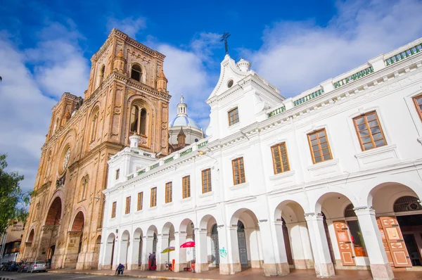 Cuenca, Ecuador - April 22, 2015: Spectacular main cathedral located in the heart of city, beautiful brick architecture and facade as seen from street level