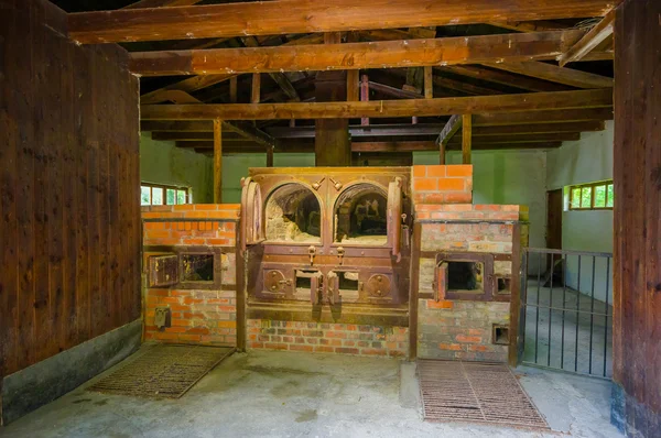 Dachau, Germany - July 30, 2015: Brick ovens inside the old crematorium building showing gruesome reality of what happened at concentration camps