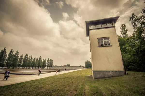 Dachau, Germany - July 30, 2015: Tall cement guard towers as seen from ground inside concentration camp, overlooking prisoners yard