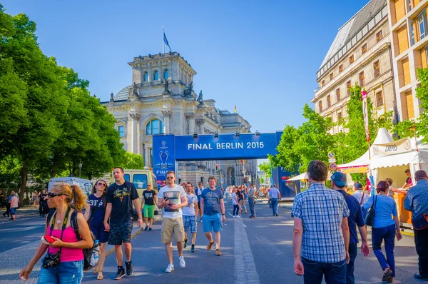 BERLIN, GERMANY - JUNE 06, 2015: Berlin center covered with advertisings of Champions league final match, people walking and celebrate