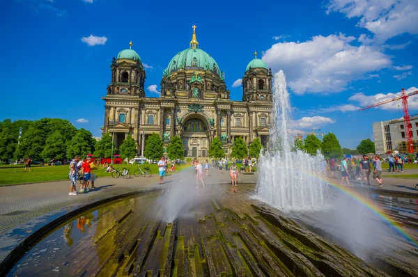BERLIN, GERMANY - JUNE 06, 2015: People enjoying the water on summer in front of Berlin Cathedral, nice view