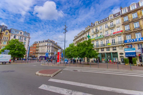 Lille, France - June 3, 2015: Nice summer day in city centre, traditional European concrete architecture, charming streets and apartment buildings