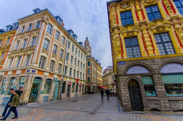 Lille, France - June 3, 2015: Side street from beautiful Place Grande with its charming buildings and traditional european architecture sorrounding the plaza on a nice summer day