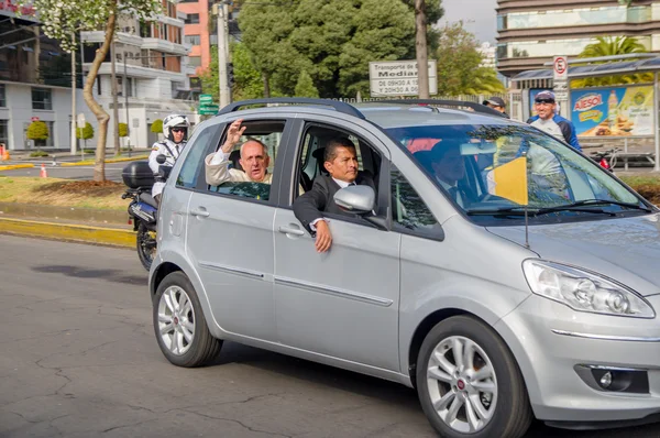 QUITO, ECUADOR - JULY 7, 2015: Grey little car transporting pope Francisco and his body guards, Ecuador visit
