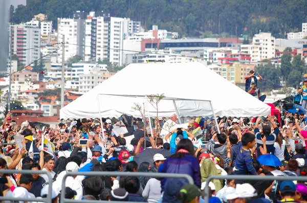 QUITO, ECUADOR - JULY 7, 2015: Pope Francisco making a little round trip around the big mass, lots of people. Mobile pope