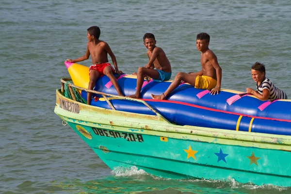 Unidentified young boys resting in an inflatable banana boat, Sua, Esmeraldas.