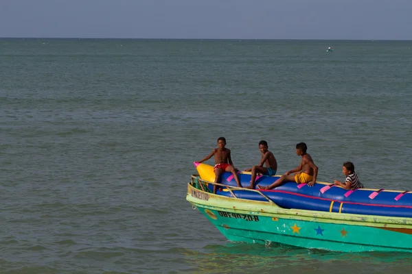 Unidentified young boys resting in an inflatable banana boat, Sua, Esmeraldas.