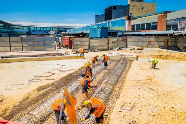 Unidentified construction workers building new terminal in the international airport el dorado bogota colombia