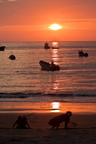 Beautiful landscape view of floating fishing boats with amazing sunset in the background, Manabi, Ecuador