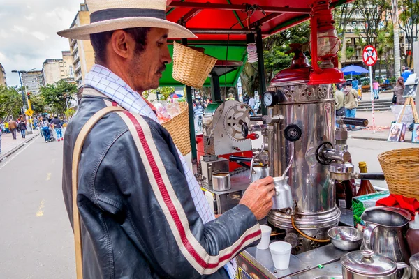 Unidentified street vendor selling fresh coffee at Candelaria neighborhood in Bogota Colombia