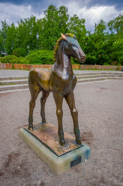 OSLO, NORWAY - 8 JULY, 2015: Statue of a young horse with scared body language located in the middle Birkelunden park