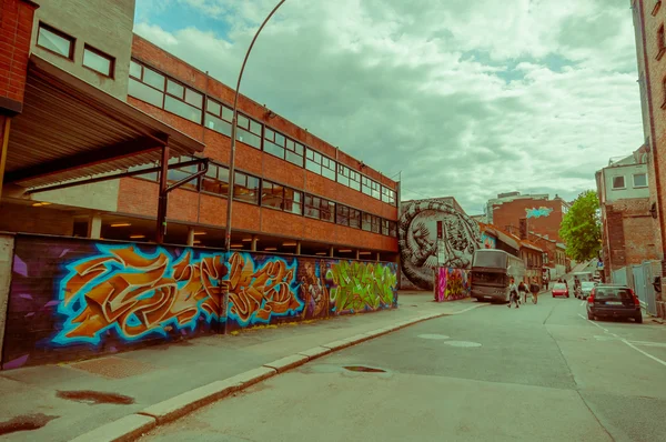OSLO, NORWAY - 8 JULY, 2015: Graffiti street art on the walls of buildings in popular artistic area Brenneriveien at Grunerlokka
