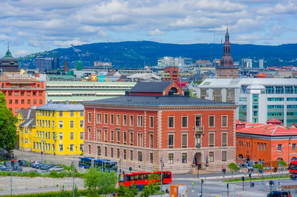 OSLO, NORWAY - 8 JULY, 2015: Great view from roof of opera building showing famous ski-jump hill Homenkollen in the distant green hillside