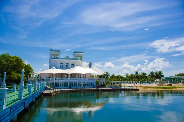 CIENFUEGOS, CUBA - SEPTEMBER 12, 2015: Cienfuegos yatch club building  and marina under bright daylight sun