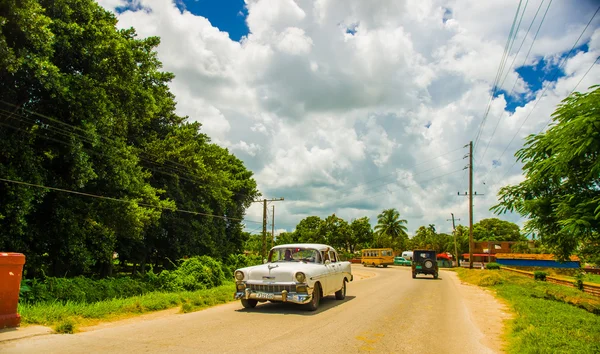 CENTRAL ROAD, CUBA - SEPTEMBER 06, 2015: American Oldtimer in the rural road system used for transportation