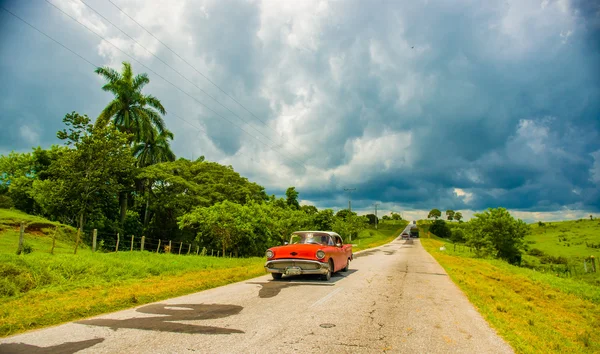 CENTRAL ROAD, CUBA - SEPTEMBER 06, 2015: American Oldtimer in the rural road system used for transportation