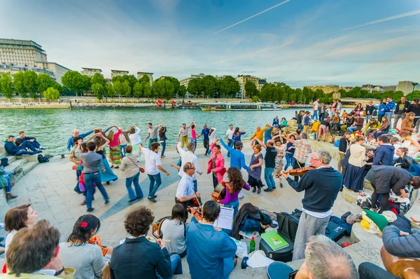 People dancing to live music in the streets of Paris, France