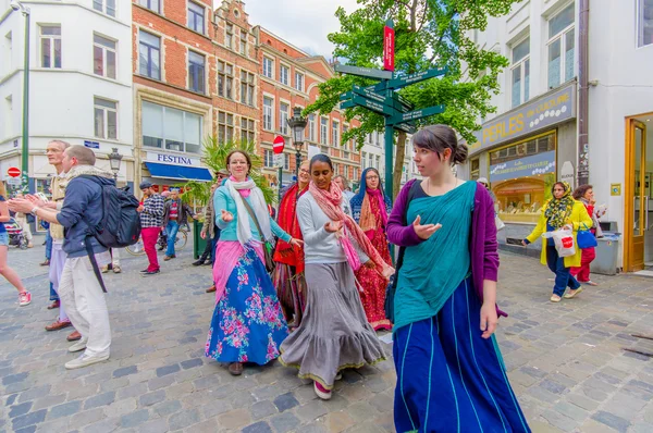 BRUSSELS, BELGIUM - 11 AUGUST, 2015: Hare Krishna street performers dancing in city centre