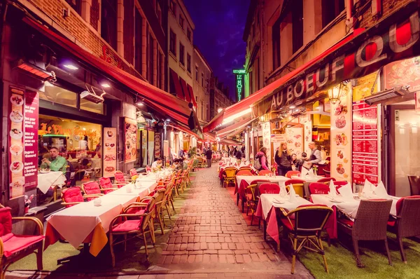 BRUSSELS, BELGIUM - 11 AUGUST, 2015: Famous street Rue des Bouchers with its fantastic charm and tightly packed restaurants during night time