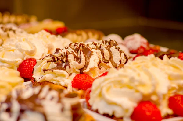 BRUSSELS, BELGIUM - 11 AUGUST, 2015: Famous belgian waffles as displayed in store with cream, berries and chocolate sauce