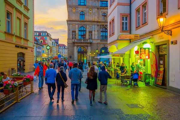 Prague, Czech Republic - 13 August, 2015: Charming city streets sorrounded by beautiful buildings seen from street level in a very nice evening light