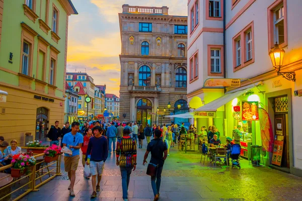 Prague, Czech Republic - 13 August, 2015: Charming city streets sorrounded by beautiful buildings seen from street level in a very nice evening light