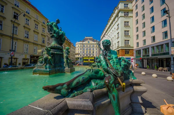 Vienna, Austria - 11 August, 2015: Very nice fountain with statues and beautiful green water located inner city, Graben area