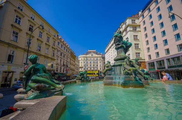 Vienna, Austria - 11 August, 2015: Very nice fountain with statues and beautiful green water located inner city, Graben area