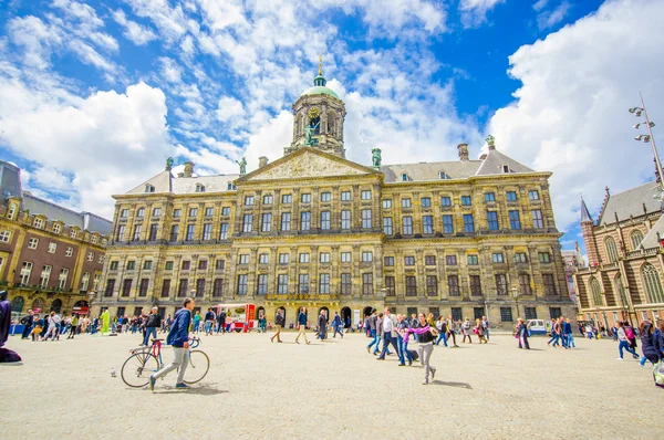 Amsterdam, Netherlands - July 10, 2015: Royal Palace on a beautiful sunny day, majestic European architecture and spectacular tower