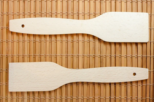 Kitchen scoops on a bamboo litter