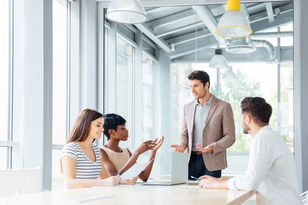 Group of young business people working together in office