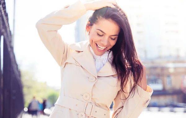 Portrait of a laughing woman outdoors