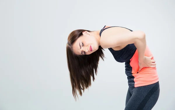 Fitness woman having back pain