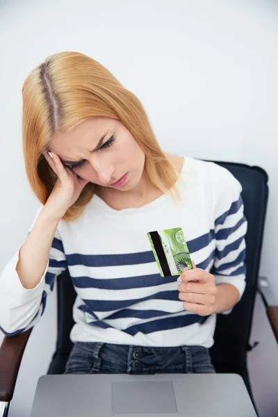 Woman holding bank card