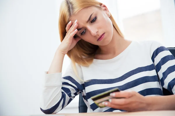 Woman holding bank card