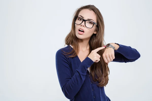 Woman pointing finger on wrist watch