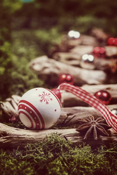Christmas vintage ball decoration on natural moss and wood