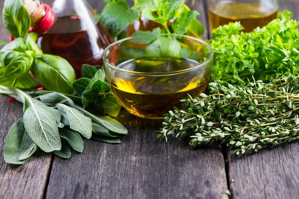 Fresh herbs from garden with olive oil