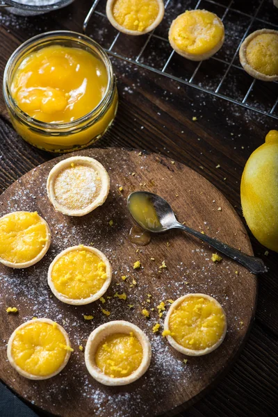 Lemon and custard tarts on cooling tray