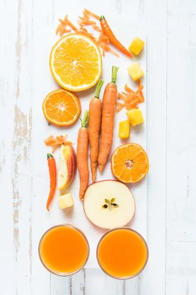 Healthy orange , carrot and apple smoothie