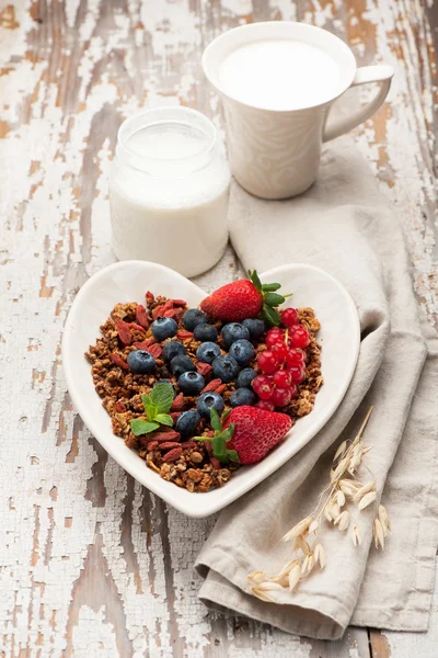 Granola, milk, yogurt , fresh berries.  Delicious breakfast
