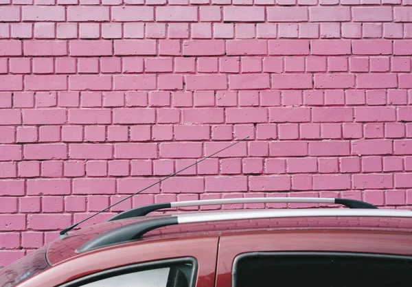 Pink wall, street background