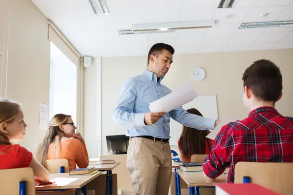 Group of students and teacher with test results