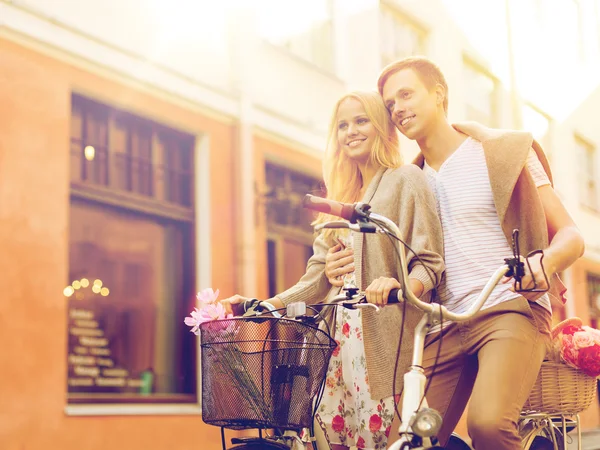 Couple with bicycles in city